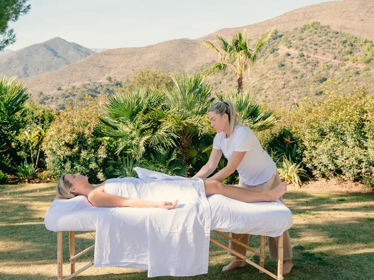 A treatment table set up on the lawn at Viluz, the sierra rising behind it.